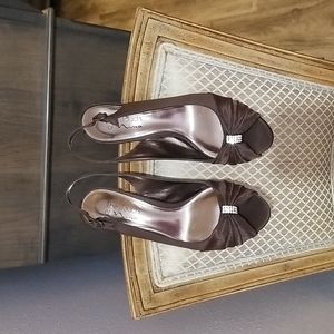 Nina brand sling back dress shoe in satin fabric embellished with stones on top.